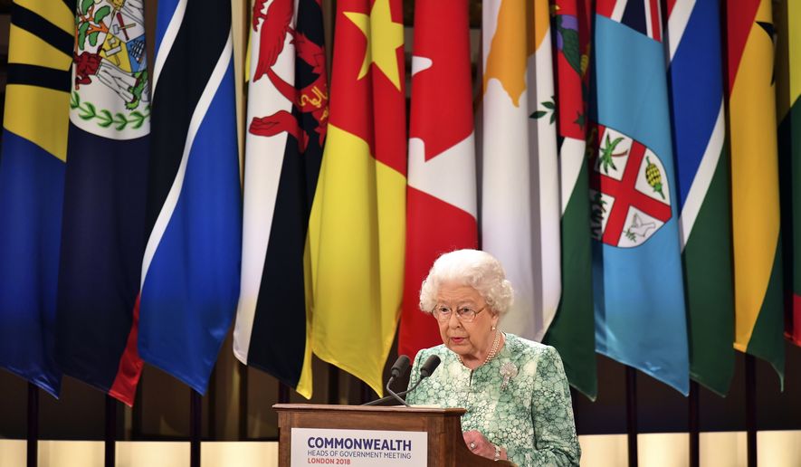 Britain's Queen Elizabeth II speaks during the formal opening of the Commonwealth Heads of Government Meeting in the ballroom at Buckingham Palace in London, Thursday April 19, 2018