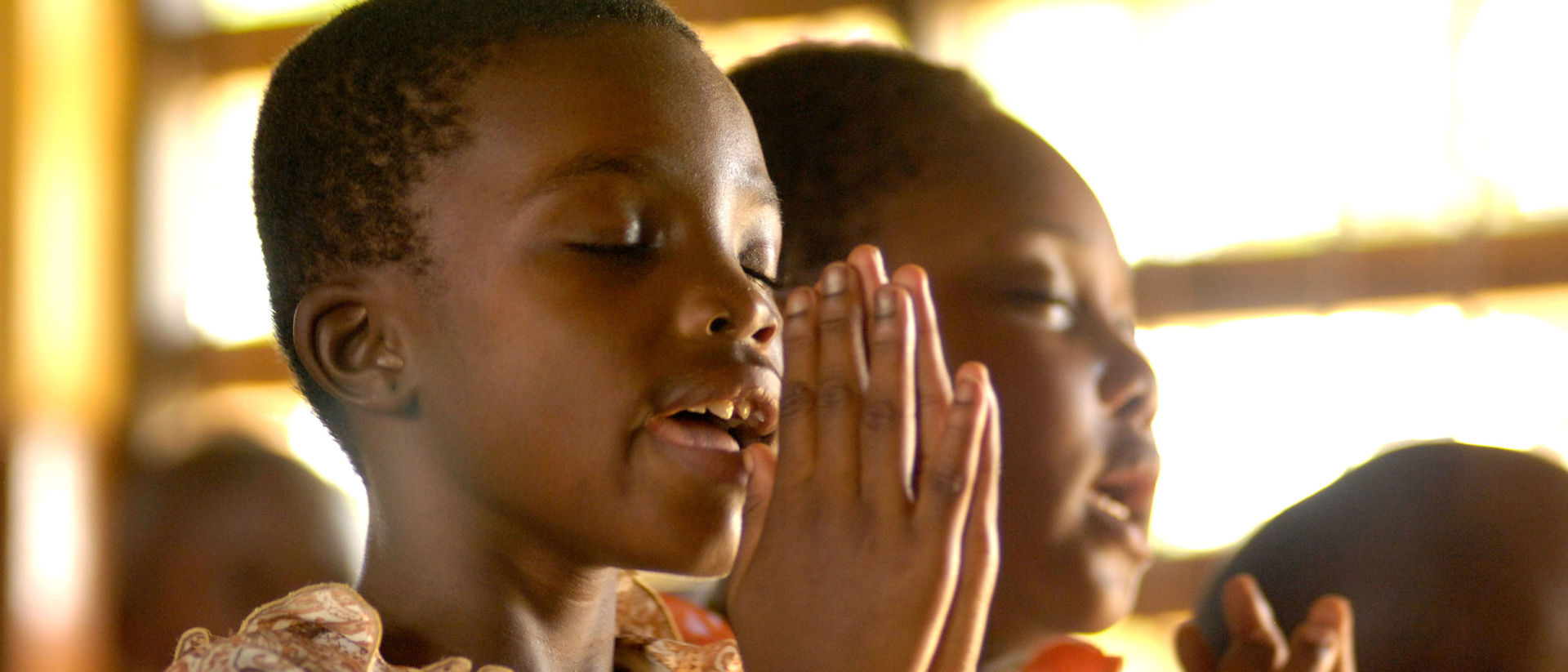 Ghanaian children praying