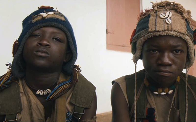 Striker with Abraham Attah on the set of ‘Beast of No Nation’